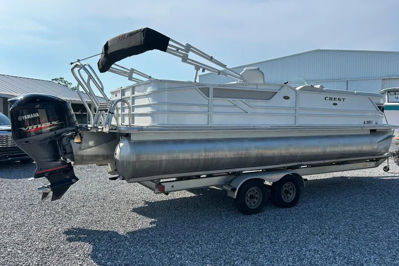 Slide: The Image of 2016 Crest Classic 250 SLR2 pontoon boat with Yamaha outboard motor on trailer. - 5