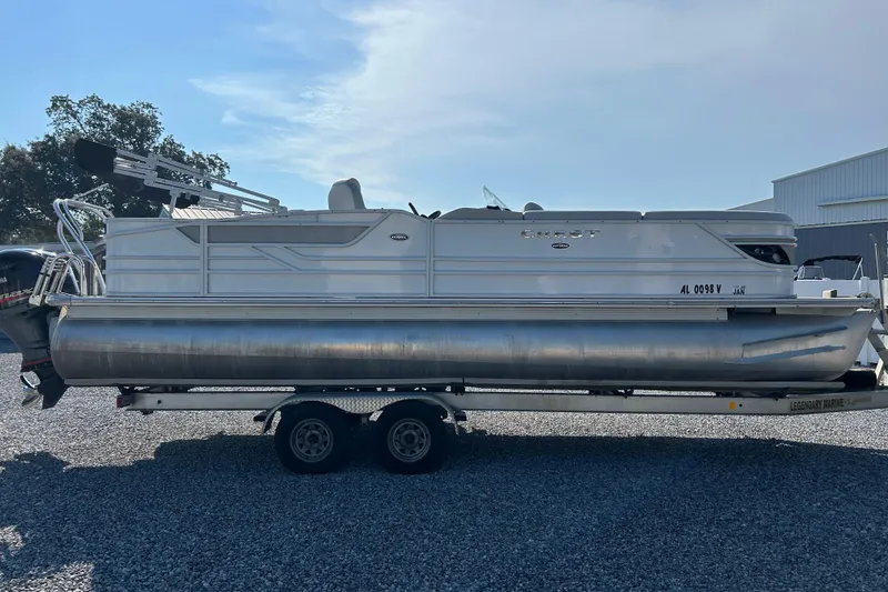 Slide: The Image of 2016 Crest Classic 250 SLR2 pontoon boat on trailer, parked outdoors. - 6