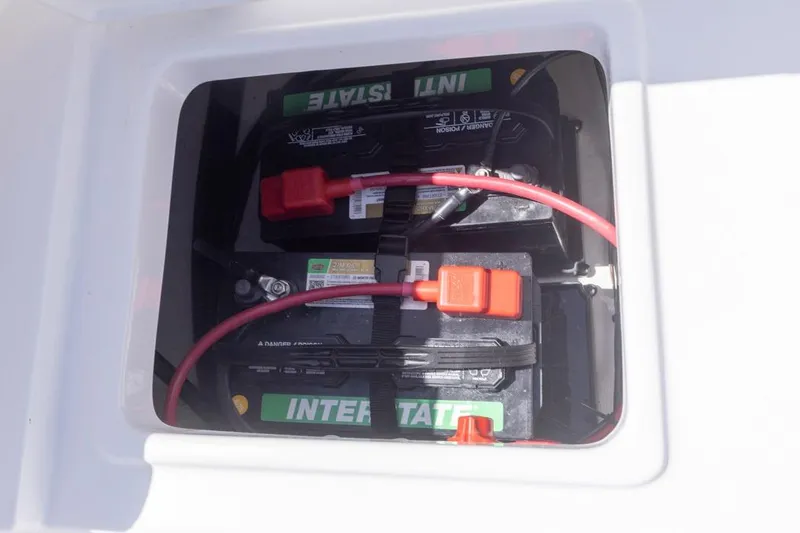 Slide: The Image of Battery compartment of 2026 Sea Hunt Ultra 234 boat with Interstate batteries. - 14