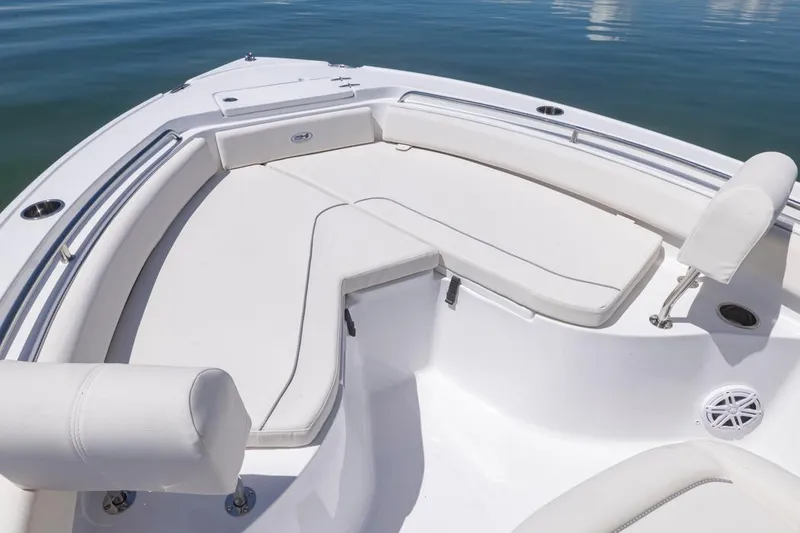 Slide: The Image of 2026 Sea Hunt Ultra 234 boat interior with white cushioned seating. - 2