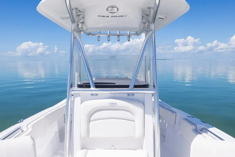 Slide: The Image of 2026 Sea Hunt Ultra 234 boat on calm ocean with clear blue sky. - 6