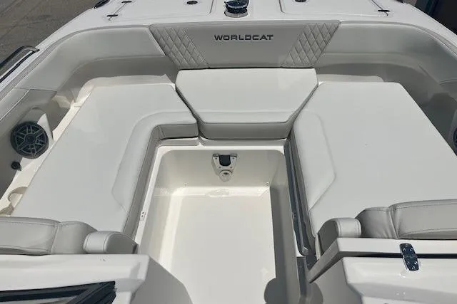 Slide: The Image of 2026 World Cat 265 DC-X boat interior with white seating and storage compartment. - 4