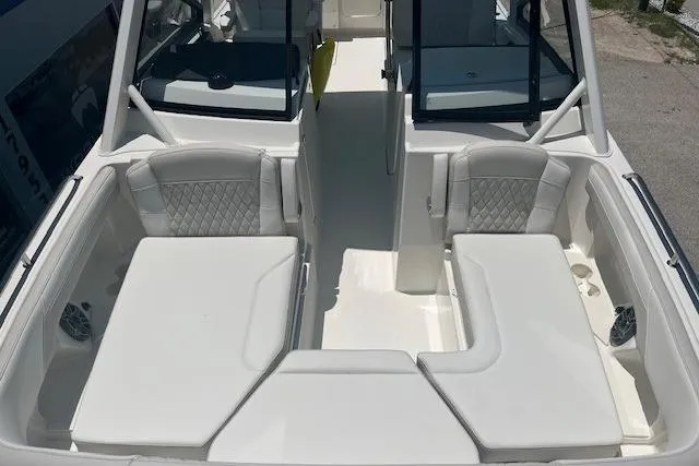 Slide: The Image of 2026 World Cat 265 DC-X boat interior with white seating and modern design. - 5