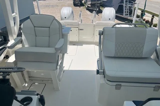 Slide: The Image of 2026 World Cat 265 DC-X boat interior with white seating and dual engines. - 6