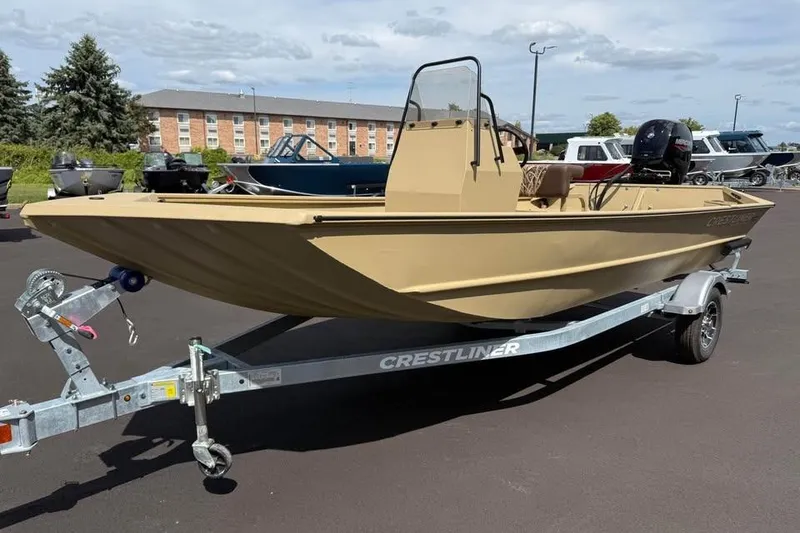The Image of 2026 Crestliner 1870 Retriever FCC boat on trailer, parked outdoors. - 0