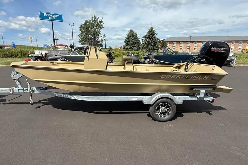 Slide: The Image of 2026 Crestliner 1870 Retriever FCC boat on trailer, parked outdoors. - 2