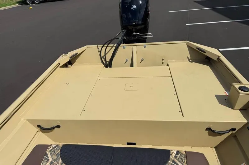 Slide: The Image of 2026 Crestliner 1870 Retriever FCC boat with outboard motor, beige deck, and camo seating. - 7