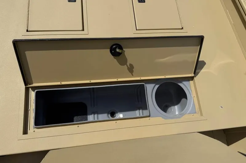 Slide: The Image of 2026 Crestliner 1870 Retriever FCC boat storage compartment with open lid. - 8