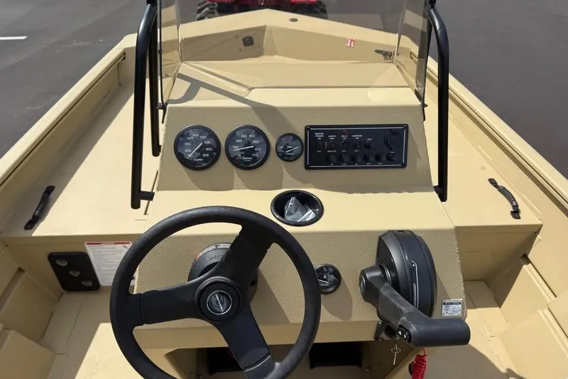 Slide: The Image of 2026 Crestliner 1870 Retriever FCC boat dashboard with steering wheel and control panel. - 9