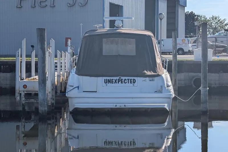 Slide: The Image of 1998 Sea Ray 370 Sundancer named "Unexpected" docked at Pier 99 marina. - 12