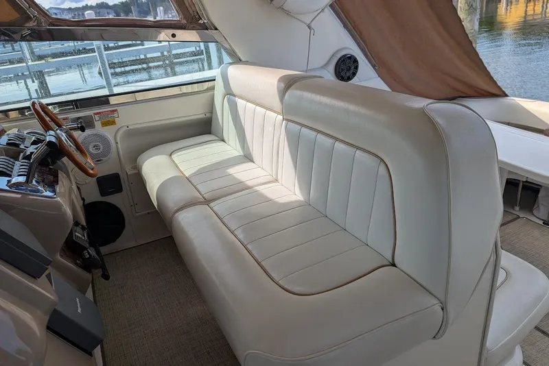 Slide: The Image of Luxurious interior of 1998 Sea Ray 370 Sundancer with plush seating and elegant design. - 25