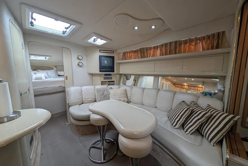Slide: The Image of Luxurious interior of a 1998 Sea Ray 370 Sundancer yacht with plush seating and modern amenities. - 32
