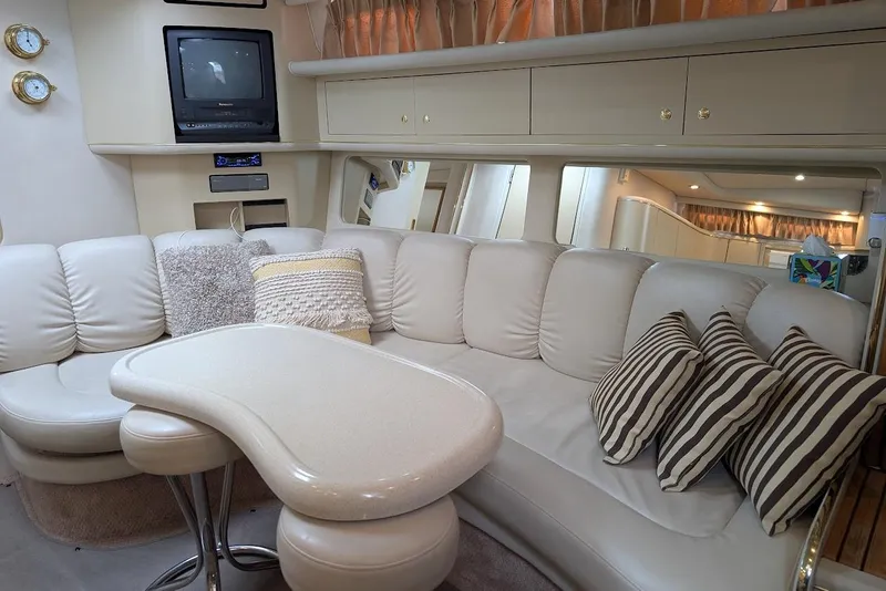 Slide: The Image of Luxurious interior of 1998 Sea Ray 370 Sundancer with plush seating and elegant decor. - 33