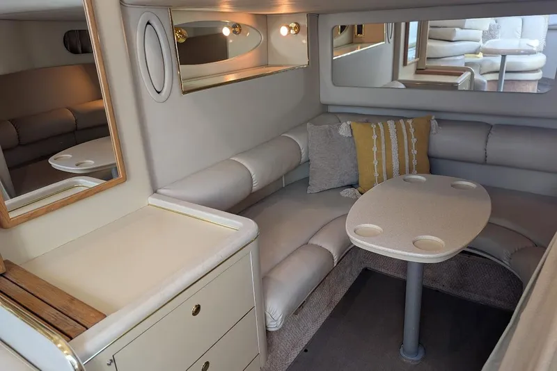 Slide: The Image of Luxurious interior of 1998 Sea Ray 370 Sundancer yacht with cozy seating and elegant decor. - 37