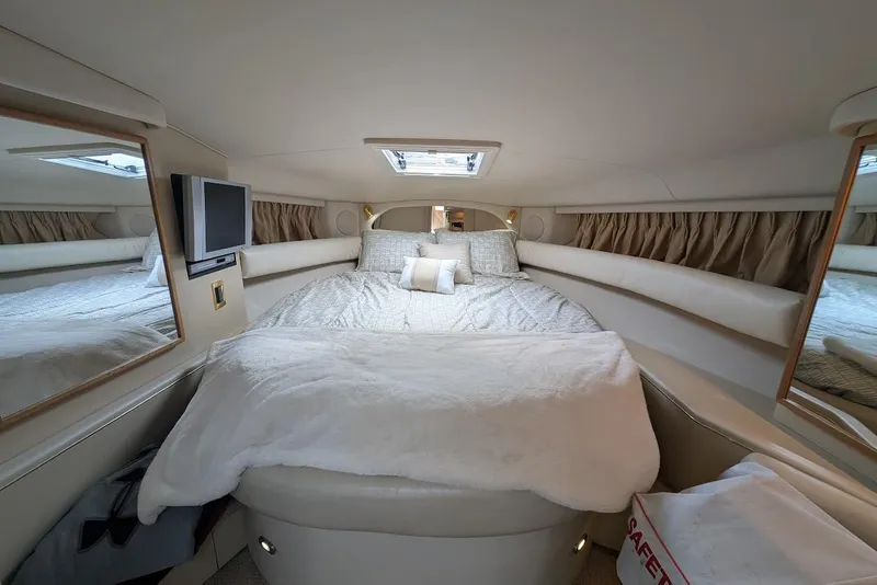 Slide: The Image of Luxurious cabin interior of 1998 Sea Ray 370 Sundancer yacht with cozy bedding. - 39