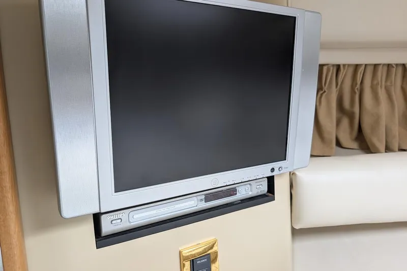 Slide: The Image of Flat-screen TV and DVD player inside 1998 Sea Ray 370 Sundancer yacht cabin. - 42