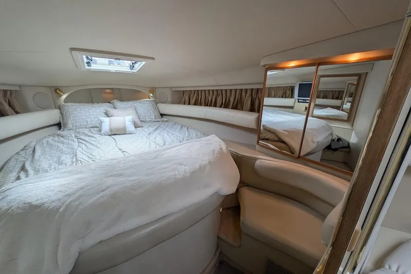 Slide: The Image of Luxurious interior cabin of 1998 Sea Ray 370 Sundancer yacht with cozy bedding. - 44