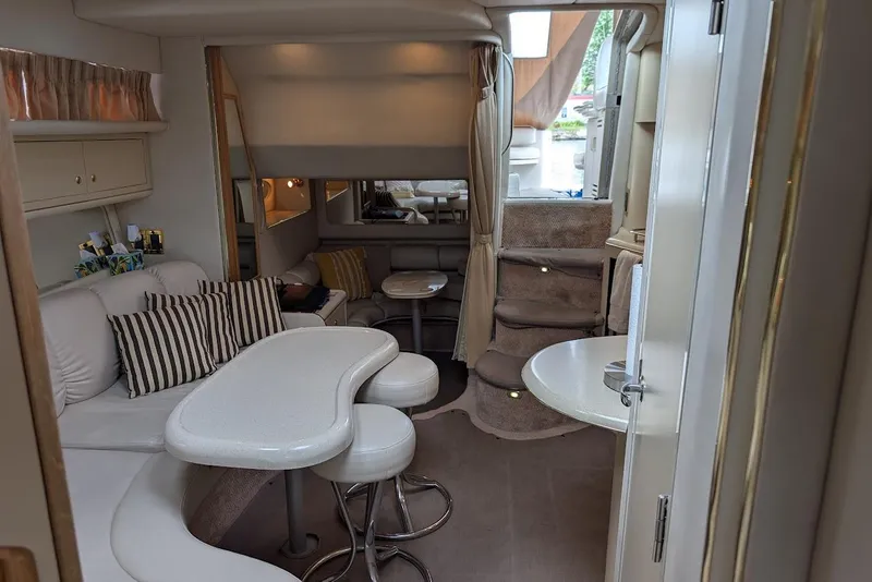 Slide: The Image of Interior of 1998 Sea Ray 370 Sundancer yacht with elegant seating and dining area. - 45