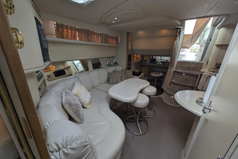 Slide: The Image of Luxurious interior of a 1998 Sea Ray 370 Sundancer yacht with plush seating and modern amenities. - 46