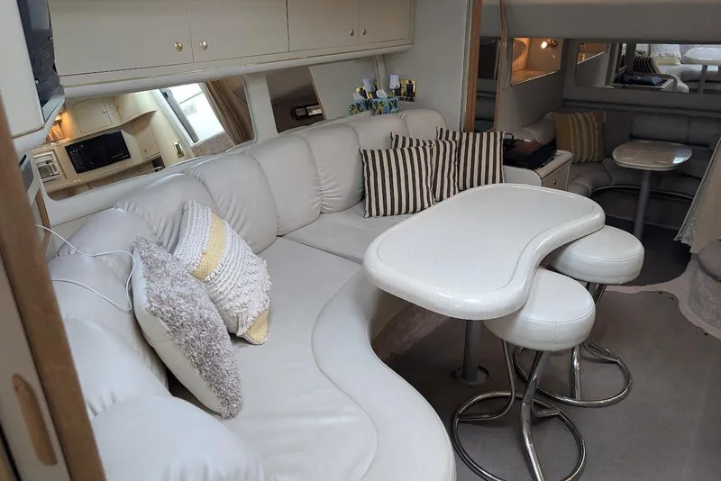 Slide: The Image of Interior of 1998 Sea Ray 370 Sundancer with plush seating and modern amenities. - 47
