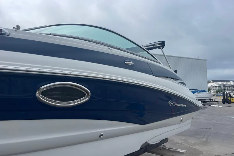 Slide: The Image of 2012 Crownline Eclipse 2 boat docked, showcasing sleek design and modern features. - 2