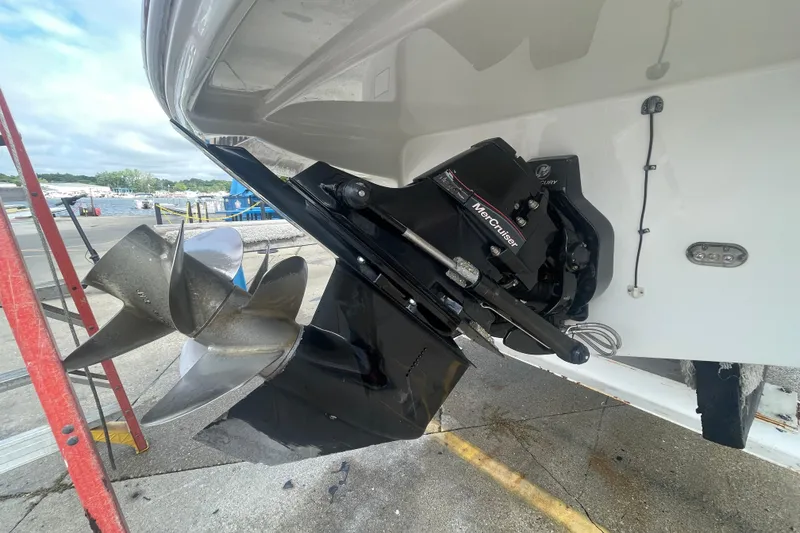 Slide: The Image of 2012 Crownline Eclipse 2 boat with MerCruiser outdrive and propeller at a marina. - 28