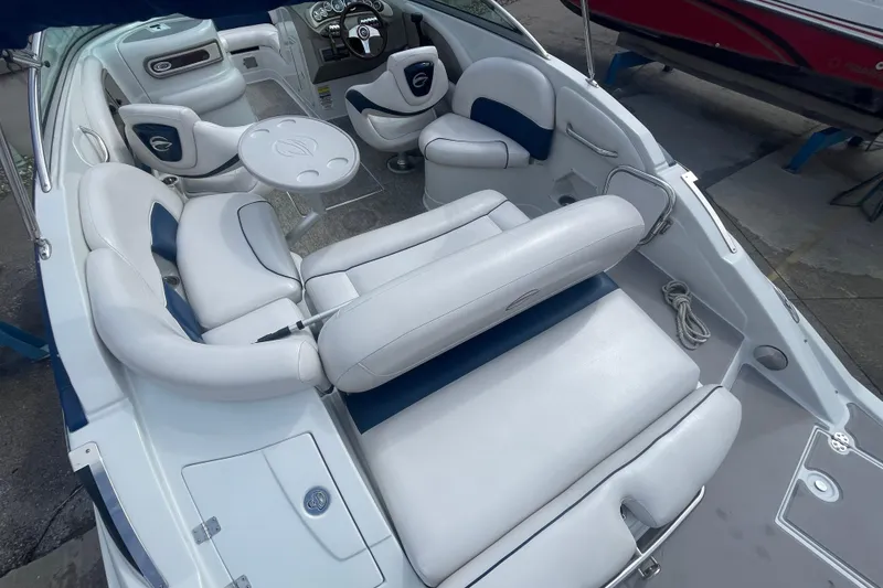 Slide: The Image of 2012 Crownline Eclipse 2 boat interior with white seating and steering console. - 7