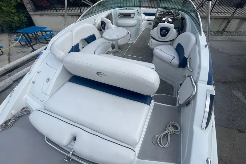 Slide: The Image of 2012 Crownline Eclipse 2 boat interior with white seating and steering console. - 8
