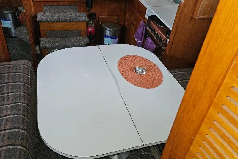 Slide: The Image of 1968 Egg Harbor Sedan interior with dining table and cozy seating area. - 11