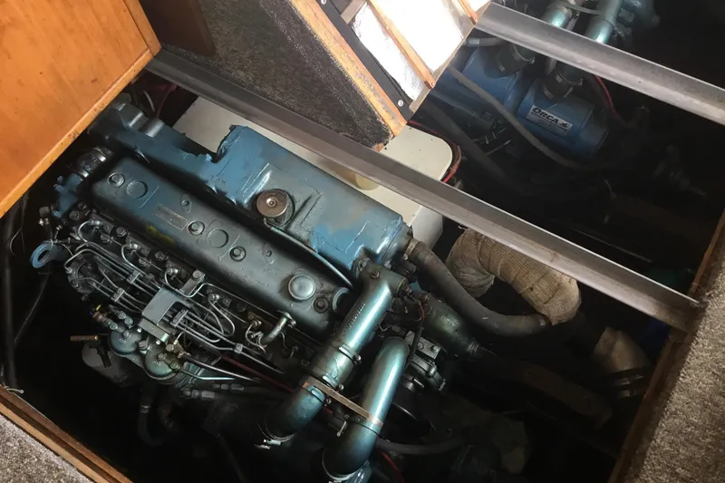 Slide: The Image of Engine compartment of a 1968 Egg Harbor Sedan, showcasing detailed mechanical components. - 23