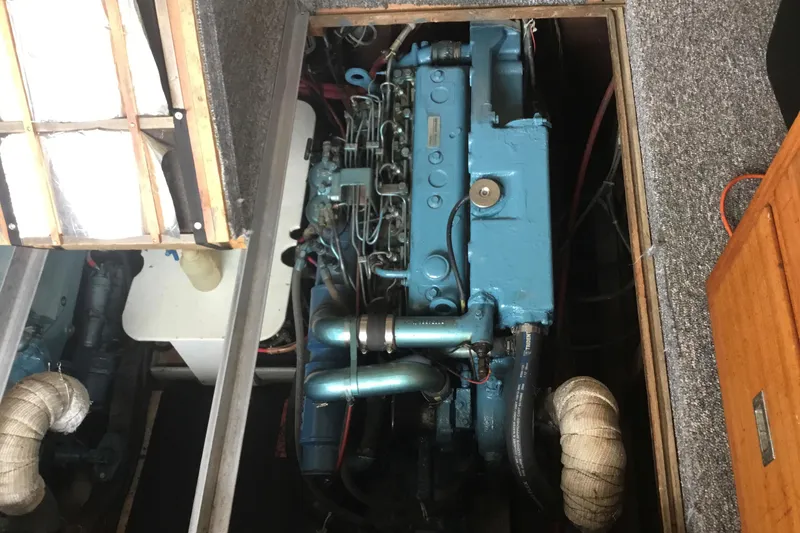 Slide: The Image of 1968 Egg Harbor Sedan engine compartment with visible blue engine components. - 24