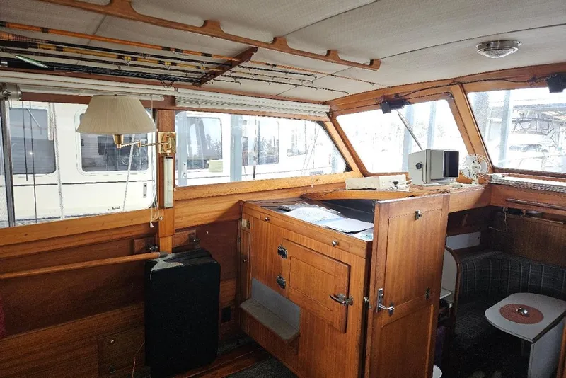 Slide: The Image of 1968 Egg Harbor Sedan interior with wooden cabinetry and nautical decor. - 5