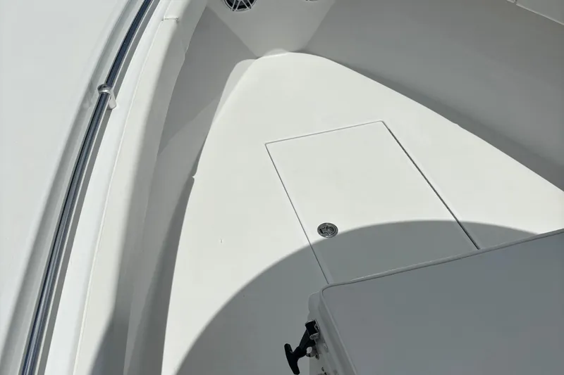 Slide: The Image of 2022 Onslow Bay 27 boat interior with storage compartment and sleek design. - 2