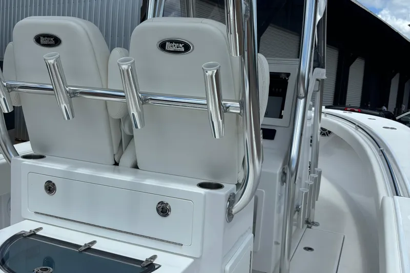 Slide: The Image of 2022 Onslow Bay 27 boat interior with rod holders and seating. - 6