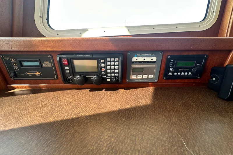 Slide: The Image of Control panel of a 2006 American Tug 41 with navigation and communication equipment. - 15