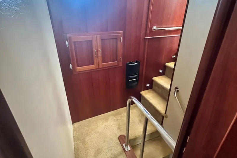 Slide: The Image of Interior view of 2006 American Tug 41, featuring stairs and a cozy cabin. - 20