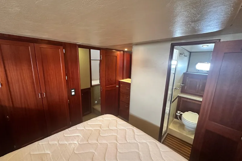 Slide: The Image of Luxurious cabin interior of 2006 American Tug 41 with cozy bed and wooden furnishings. - 24