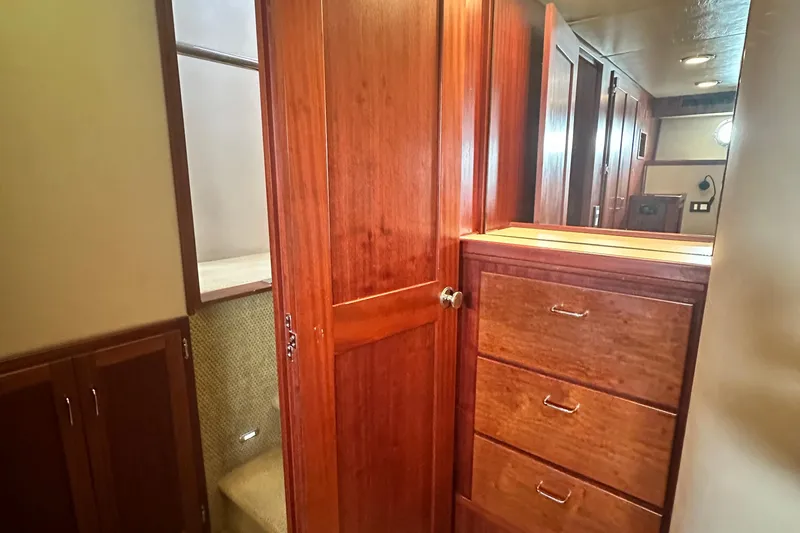Slide: The Image of Interior of 2006 American Tug 41 with wood cabinetry and ensuite bathroom. - 25