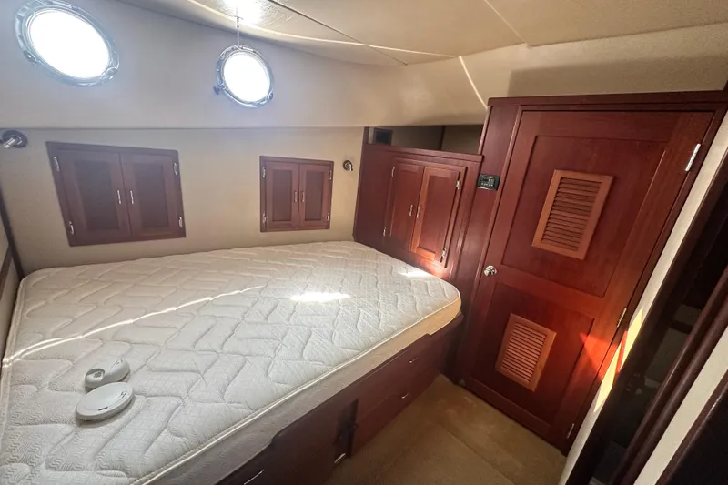 Slide: The Image of SeaVac vacuum system on 2006 American Tug 41, mounted on wooden wall near carpeted stairs. - 30