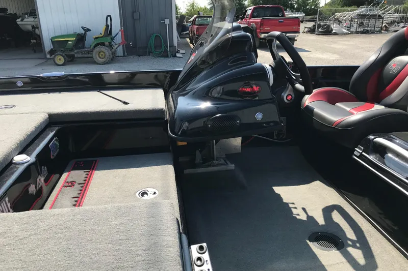 Slide: The Image of 2023 Bass Cat Pantera II boat interior with steering console and seating. - 10