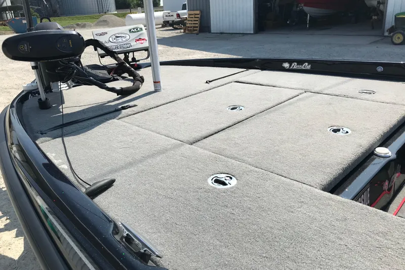 Slide: The Image of 2023 Bass Cat Pantera II boat deck with trolling motor and storage compartments. - 11