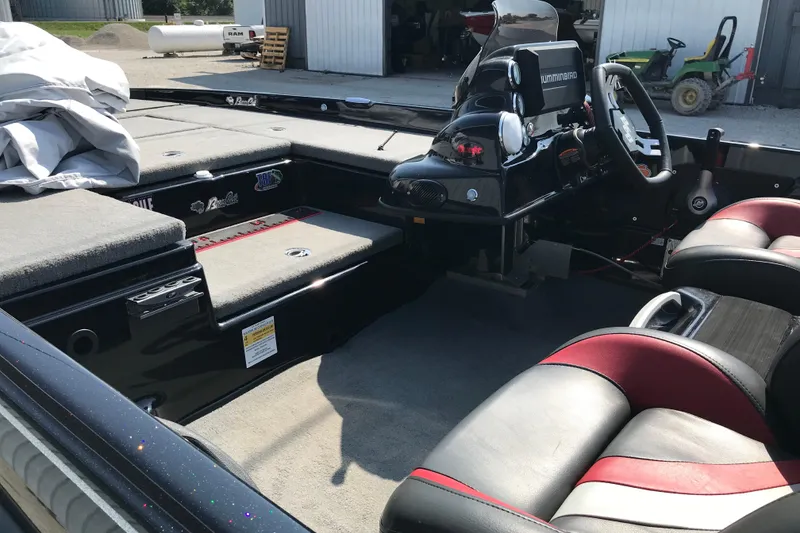 Slide: The Image of 2023 Bass Cat Pantera II boat interior with steering console and seating. - 14