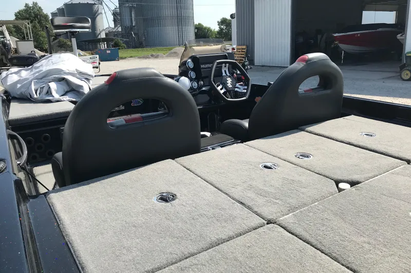 Slide: The Image of 2023 Bass Cat Pantera II boat interior with dual seats and control panel. - 15