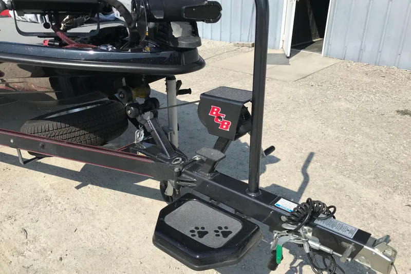 Slide: The Image of 2023 Bass Cat Pantera II boat trailer with B&B step and paw print design. - 19