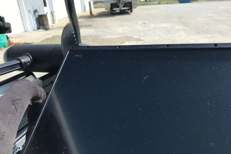 Slide: The Image of 2023 Bass Cat Pantera II boat dashboard with GPS display in outdoor setting. - 20