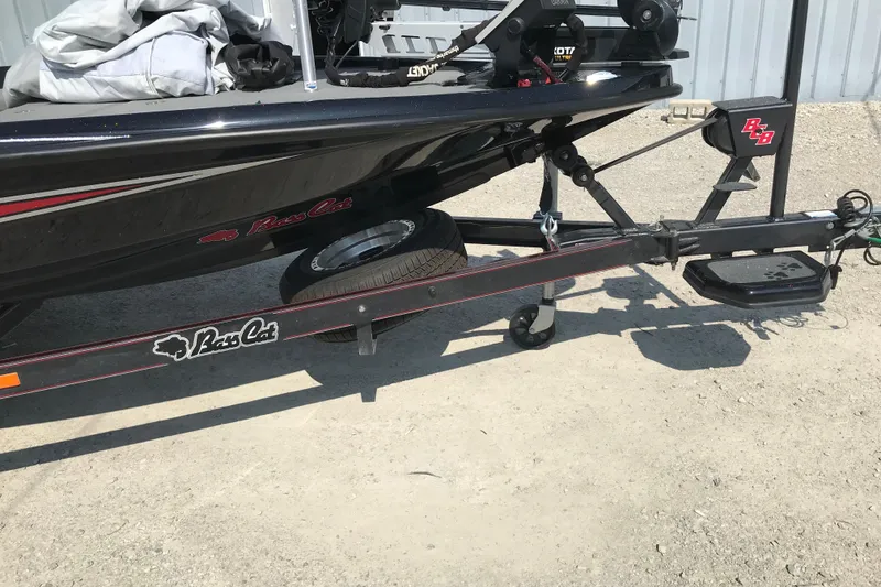 Slide: The Image of 2023 Bass Cat Pantera II boat on trailer, parked on gravel. - 23