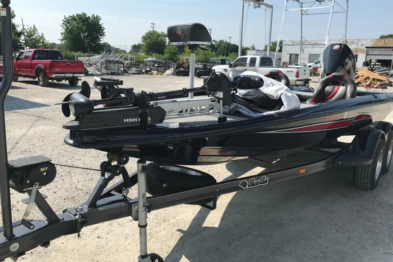 Slide: The Image of 2023 Bass Cat Pantera II boat on trailer in outdoor setting. - 24