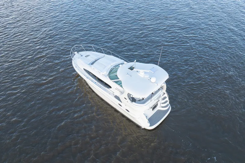 Slide: The Image of Aerial view of 2007 Sea Ray 40 Motor Yacht cruising on open water. - 12