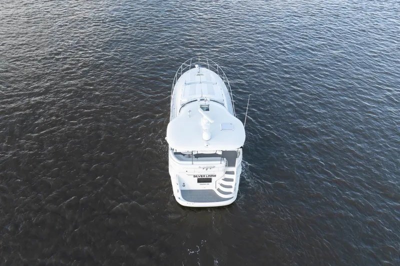 Slide: The Image of Aerial view of 2007 Sea Ray 40 Motor Yacht cruising on open water. - 13