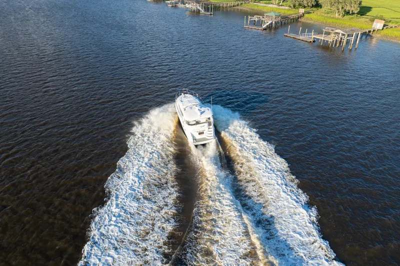 Slide: The Image of Aerial view of 2007 Sea Ray 40 Motor Yacht cruising on a river. - 16